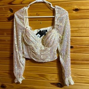NWT.  Ivory sequin crop top. Zipper back closure with a built in bra.